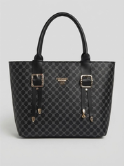 Front view of a black monogram patterned tote handbag featuring dual buckle straps and gold hardware against a light gray background.