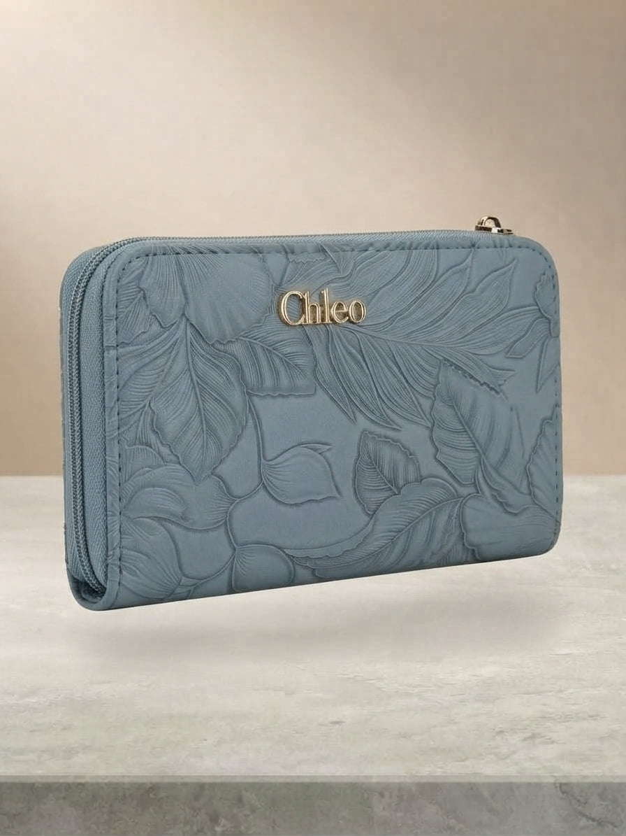 Side profile view of the blue textured wallet showing the double-zipper design.